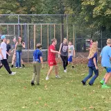 teens playing soccer